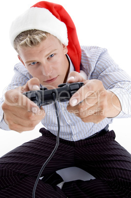 caucasian man with remote and christmas hat