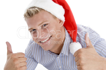 happy man with christmas hat wishing good luck