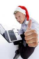 man with christmashat and laptop