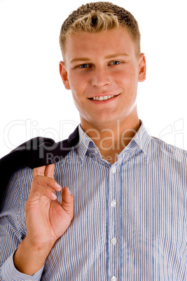 smiling man holding his coat