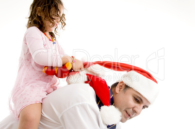 girl holding her toy riding on father's back