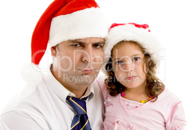 father and daughter wearing santa hat