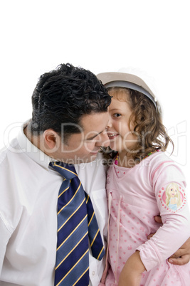 daughter whispering in his father's ear