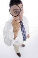businessman looking through lens