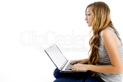 blonde female student working on laptop