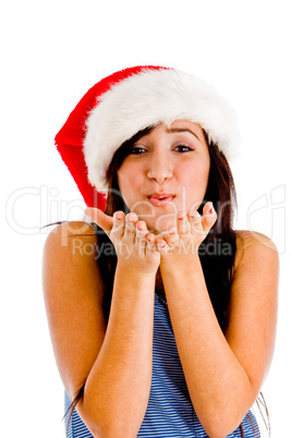 female wearing christmas hat and giving you flying kiss