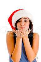 female wearing christmas hat and giving you flying kiss