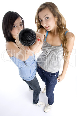 young girls showing microphone