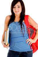 college girl posing with bag and books
