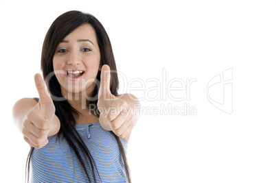 happy  teenager female showing goodluck sign