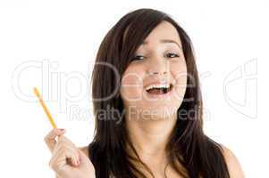 smiling girl with pencil looking you