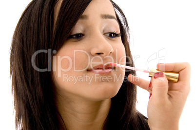 beautician doing the lip make up of female