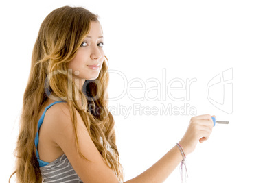 teenager posing with key