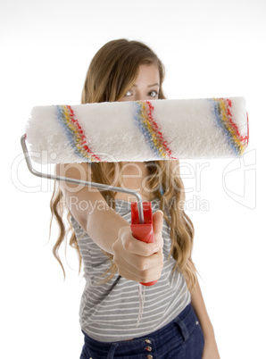 cute teen girl showing roller brush