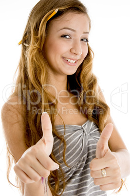 smiling teenager student with goodluck sign
