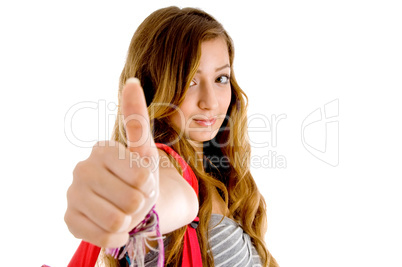 beautiful teenager school girl showing thumbs up