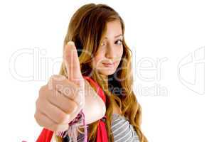 beautiful teenager school girl showing thumbs up