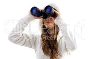 attractive model watching through binocular