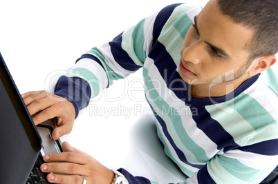 teenager guy working on laptop