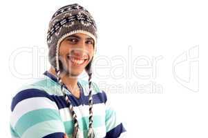 smiling boy covering his head with woolen cap