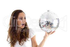 female holding mirror ball with one hand
