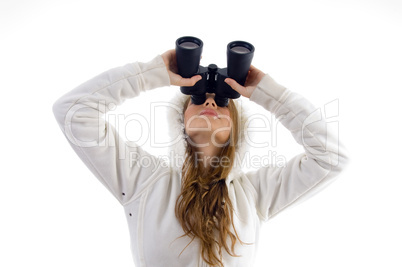 female watching upward through binocular