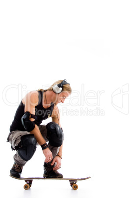 man listening music on skate board