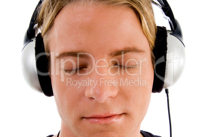 handsome male tuned into music