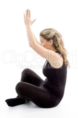 side view of girl doing yoga