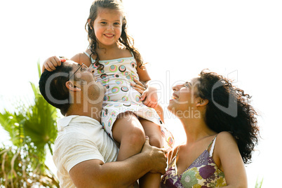 Young girl sitting on shoulders