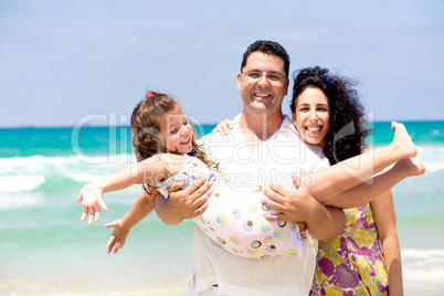 Family enjoying on the beach