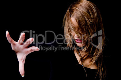 portrait of smiling woman hiding her face with hair