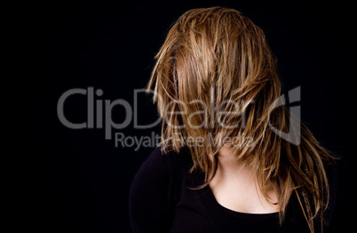 portrait of woman hiding her face with hair