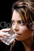 close view of beautiful woman drinking water
