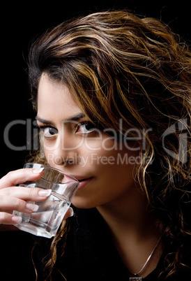 close view of beautiful model drinking water