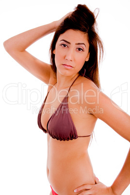 side view of sexy female in bikini looking at camera