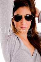 portrait of smiling model with sunglasses holding her hair