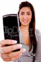 portrait of smiling woman showing cell phone