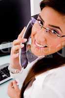 side pose of smiling professional talking on phone