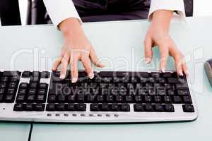 close view of hands operating keyboard