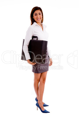 side view of young professional holding bag