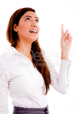 portrait of businesswoman pointing up