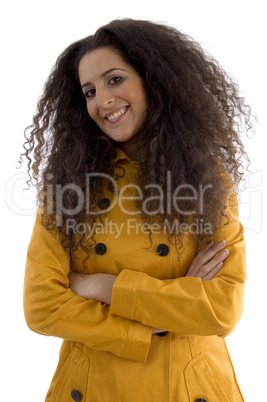 portrait of beautiful young female posing with arms crossed