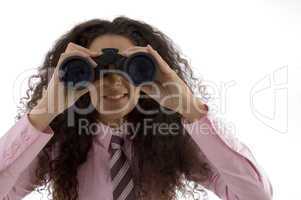 young corporate woman viewing through binoculars
