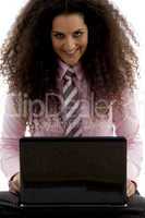 young hispanic female busy working on laptop