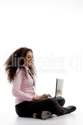 young hispanic female busy working on laptop