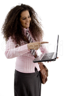 smart young businesswoman pointing at laptop