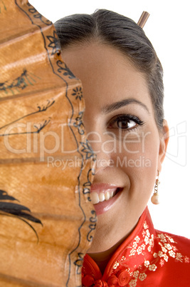 smiling face of female covered with umbrella