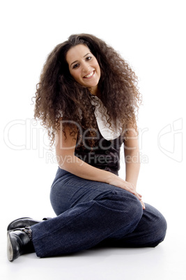 smiling woman sitting on the floor
