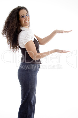 young woman posing like holding something with hand gesture